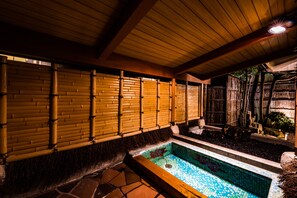 A traditional Japanese onsen with a wooden ceiling and bamboo walls. - Shoheiso Ryokan (Izunokuni)