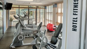 A hotel fitness center with treadmills, weight machines, and exercise balls. - Hampton Inn Detroit/Roseville (Clinton Township)