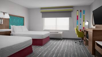Habitación de hotel con dos camas, un escritorio, una silla, un televisor, una ventana y una pared con rayas verticales de colores.