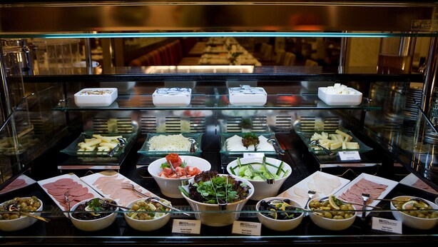 A buffet with various food items including salads, meats, and cheeses. - Hilton Garden Inn Kutahya (Kutahya)