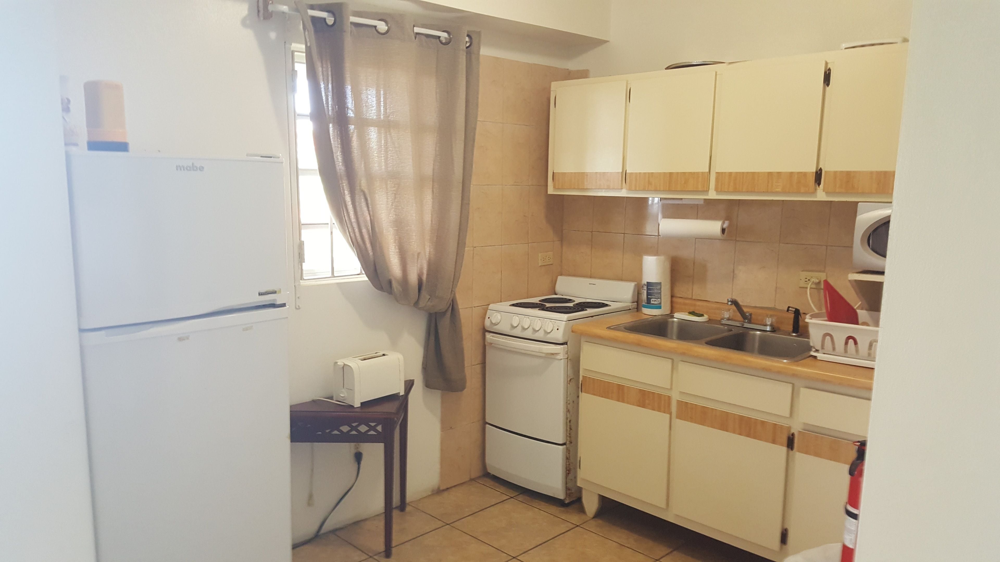 basic apartment, 1 bedroom | private kitchen | full-sized fridge, microwave, stovetop, coffee/tea maker