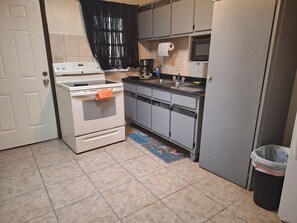 Apartment, 3 Bedrooms, Ocean View | Private kitchen | Full-size fridge, microwave, stovetop, coffee/tea maker - Sunset Gardens Guesthouse (St. Thomas)