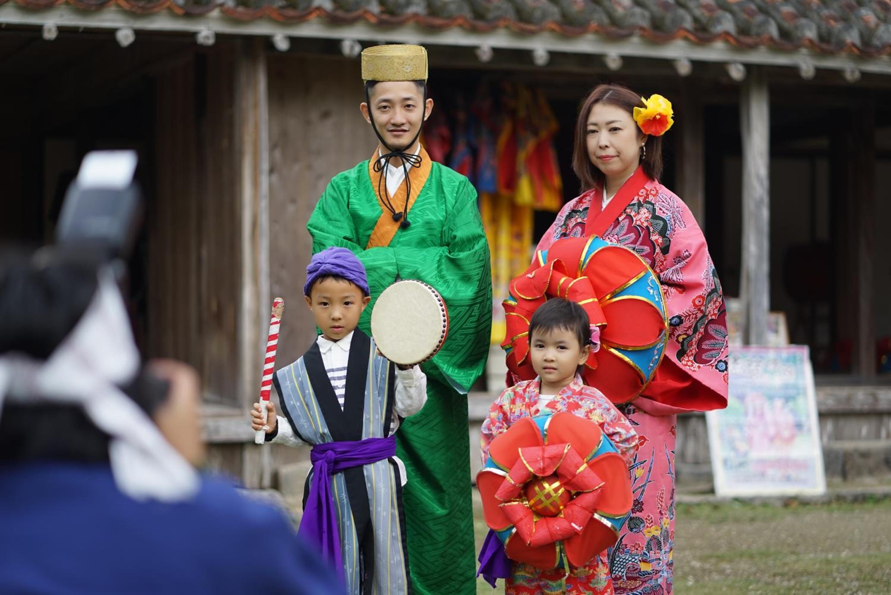 A traditional performance with performers in colorful costumes.