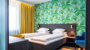 A hotel room with a bed, a desk, a chair, and a nightstand. - Thon Hotel Alta (Alta)