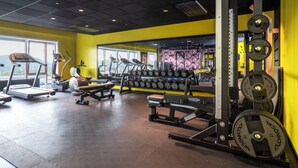 A gym with treadmills, elliptical machines, and weightlifting equipment. - Thon Hotel Alta (Alta)