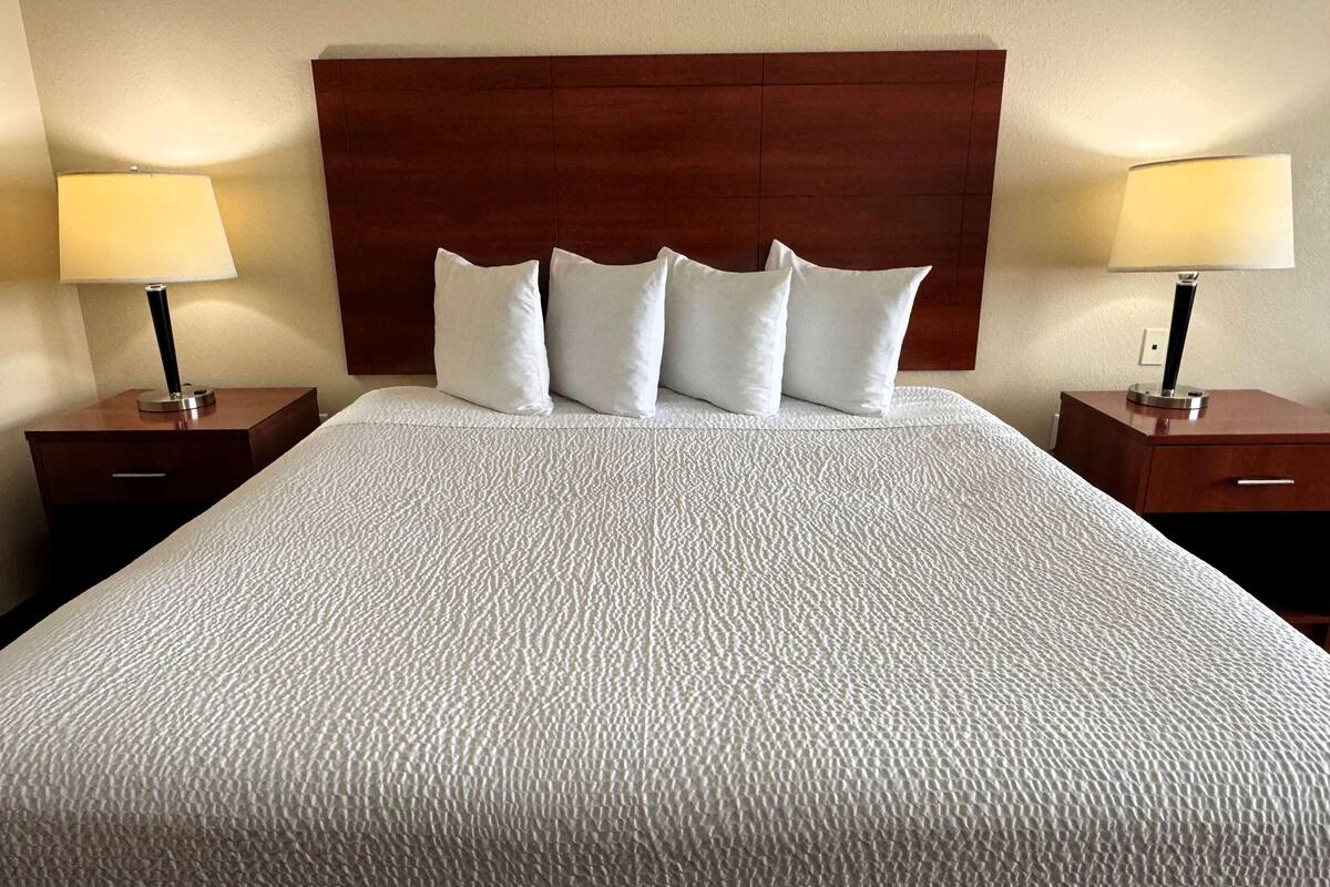 standard room, 1 king bed | pillow-top beds, desk, blackout curtains, iron/ironing board