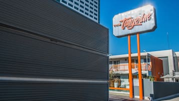 A building with a sign that reads "The Tangerine."