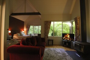 Cottage, 1 Queen Bed (Steeple) | Living area | 32-inch flat-screen TV with digital channels, TV, fireplace - Cottages at Monreale (Olinda)