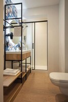 Shower, eco-friendly toiletries, hair dryer, towels