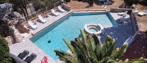 Seasonal outdoor pool, open 9:30 AM to 9:00 PM, pool umbrellas