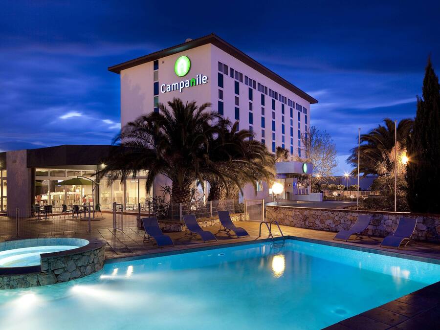 Seasonal outdoor pool, open 9:30 AM to 9:00 PM, pool umbrellas