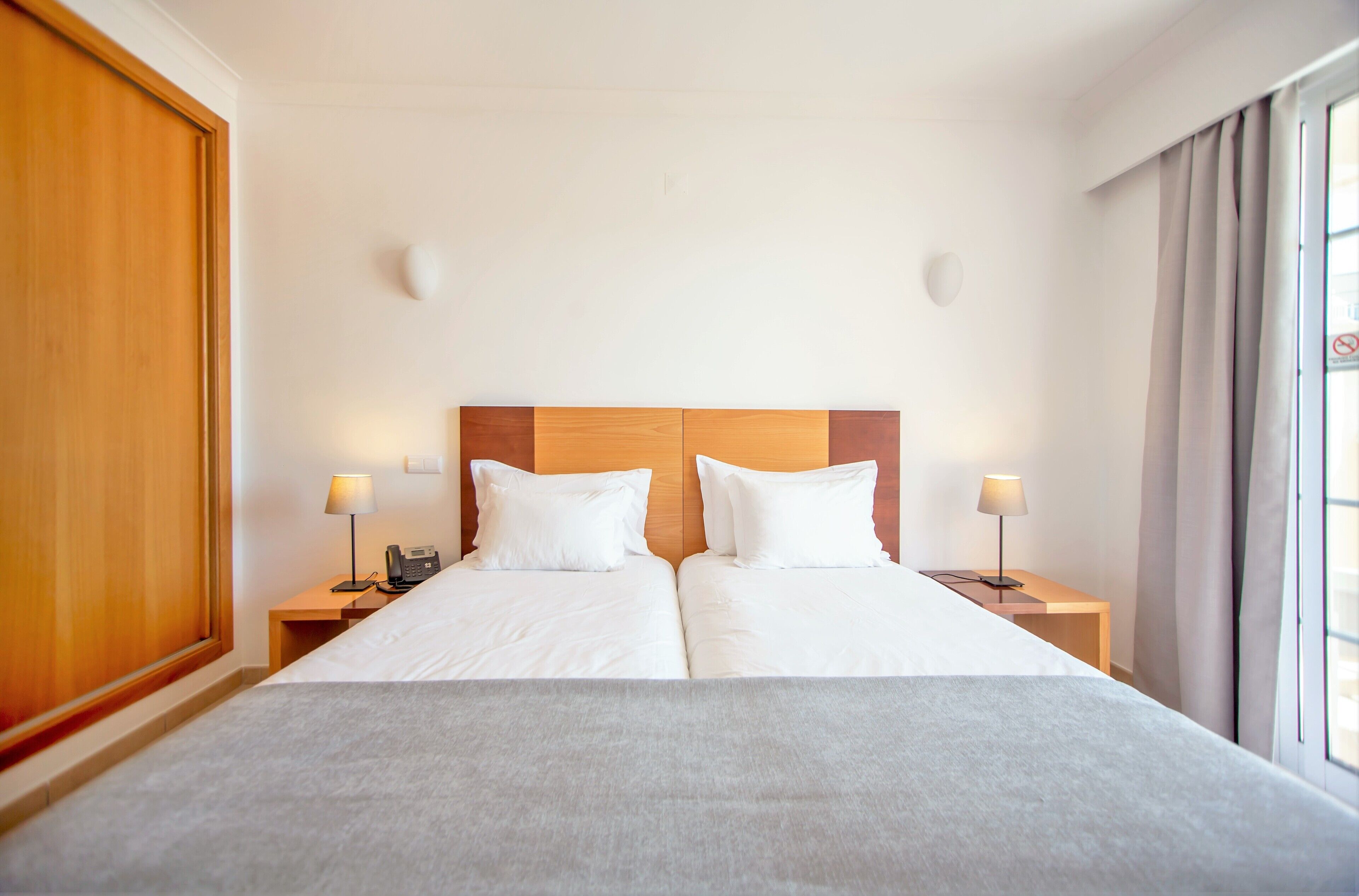 superior apartment, 1 bedroom, pool view | 1 bedroom, desk, blackout curtains, iron/ironing board