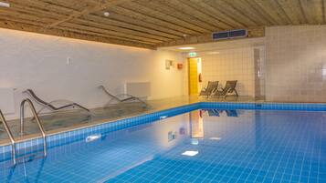 Indoor pool, open 8:00 AM to 8:00 PM, pool loungers