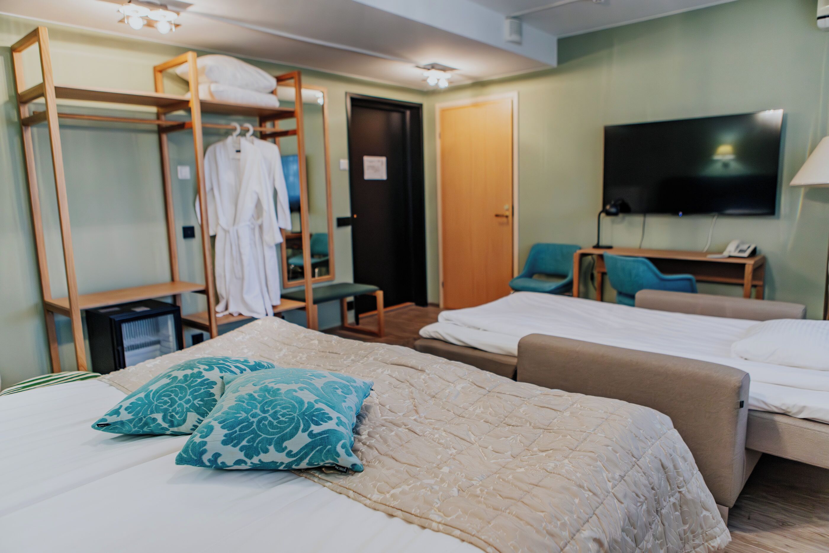 minibar, desk, blackout curtains, iron/ironing board