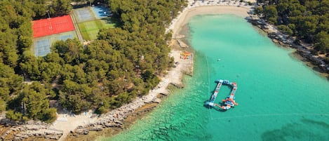 On the beach, white sand, free beach cabanas, sun loungers