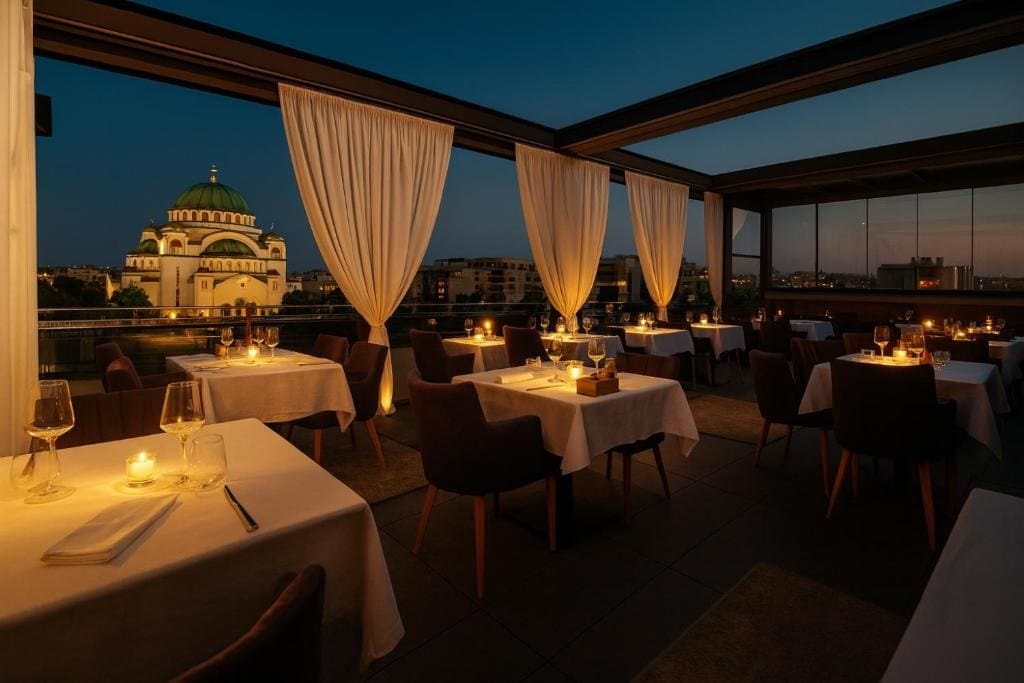 An outdoor dining area with tables set for dinner, overlooking a cityscape with a prominent building with a green dome.