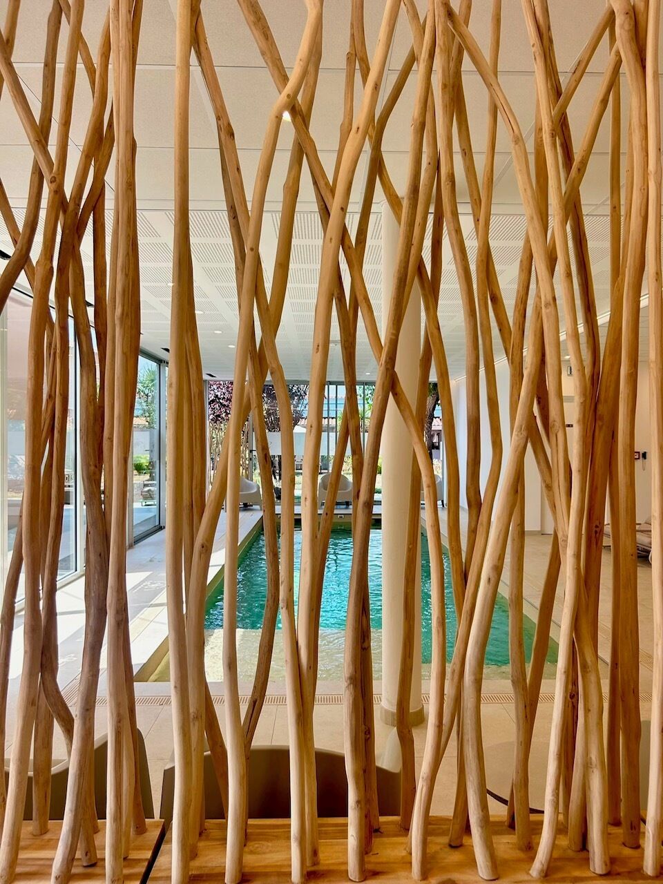 A pool area with a wooden structure in the foreground.