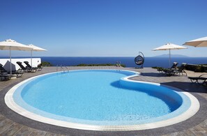 Seasonal outdoor pool, pool umbrellas, pool loungers