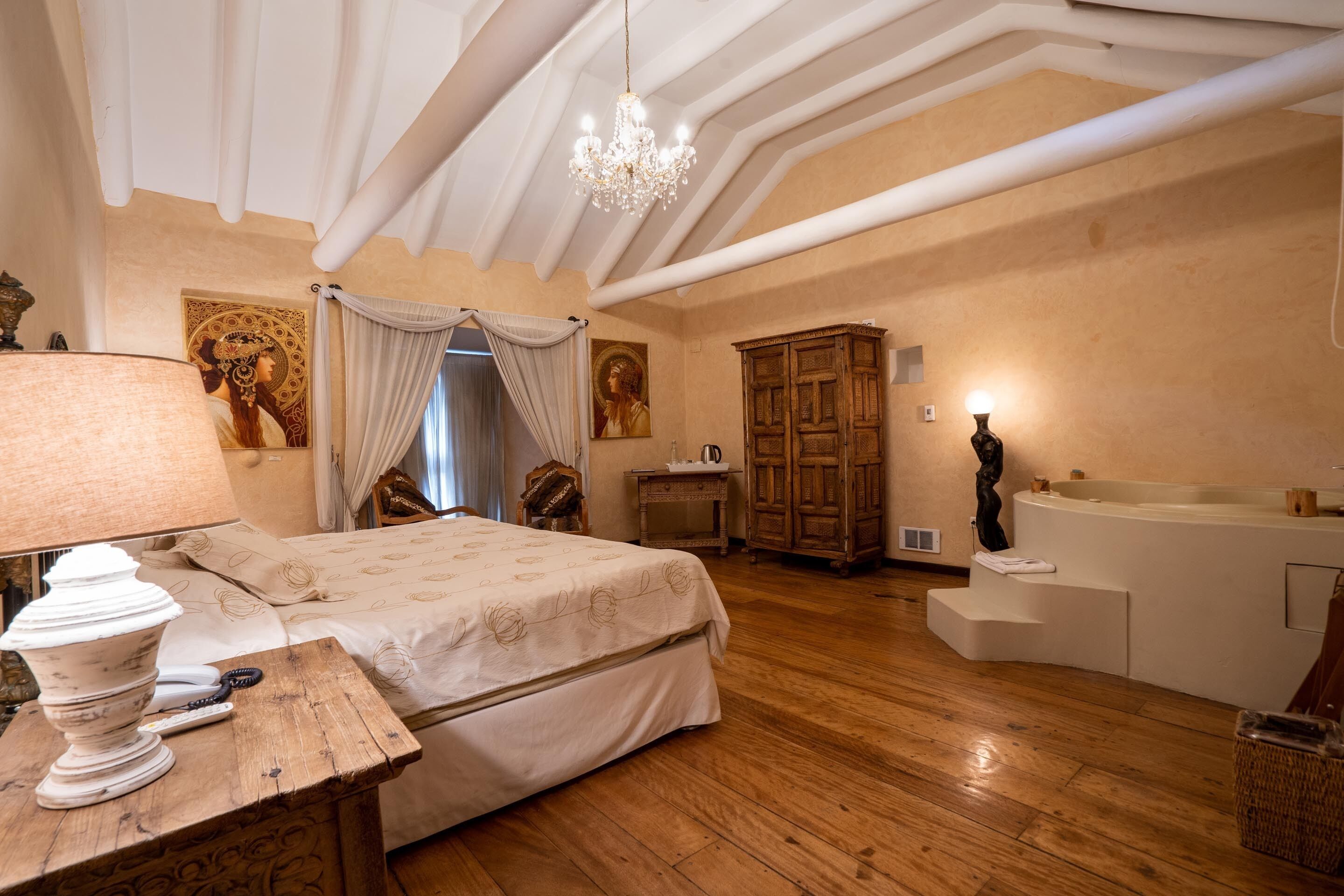 premium suite, 1 king bed, jetted tub | in-room safe, individually decorated, individually furnished, free wifi