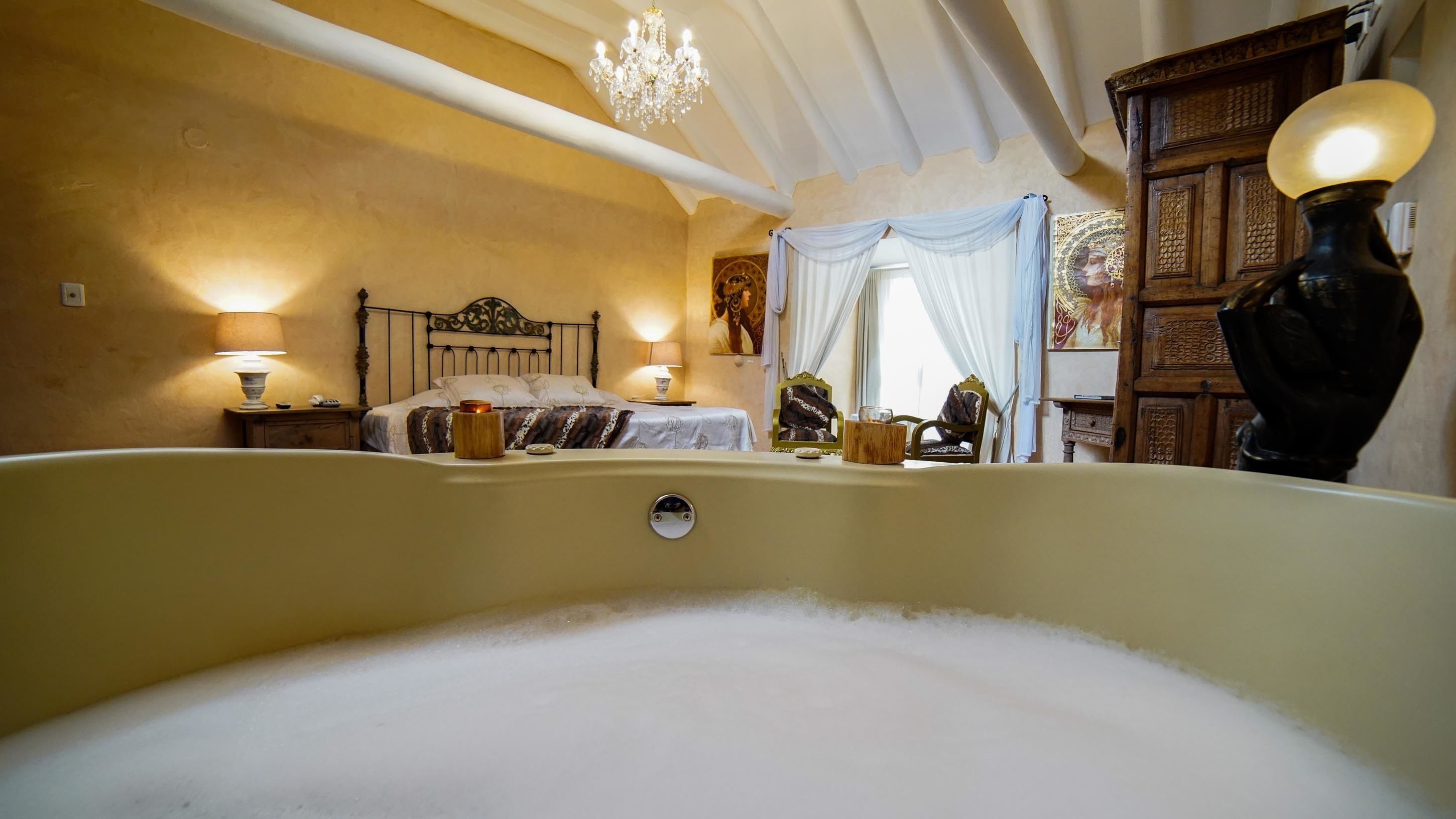 premium suite, 1 king bed, jetted tub | in-room safe, individually decorated, individually furnished, free wifi