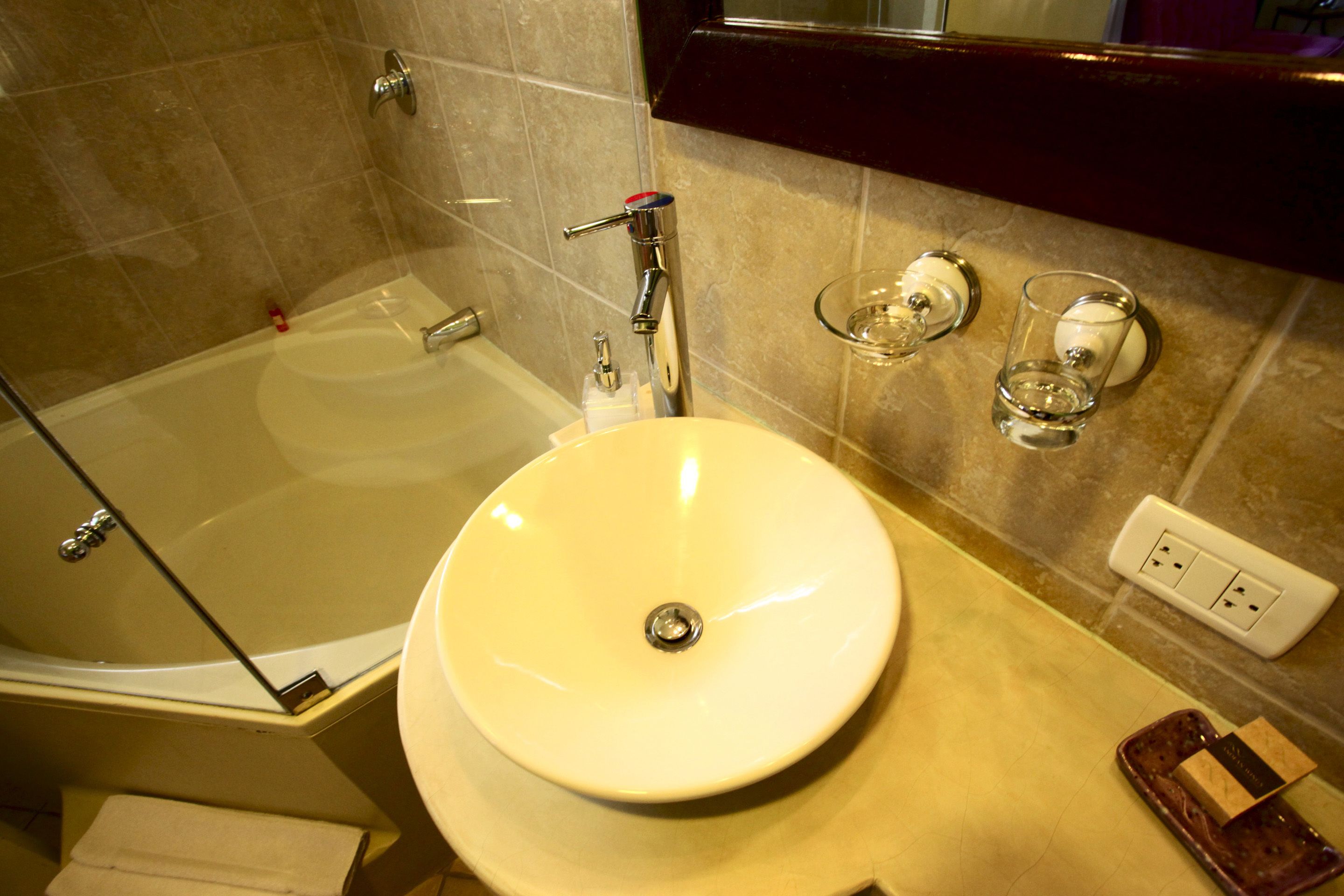 comfort suite, 1 king bed, bathtub | bathroom | shower, rainfall showerhead, free toiletries, hair dryer
