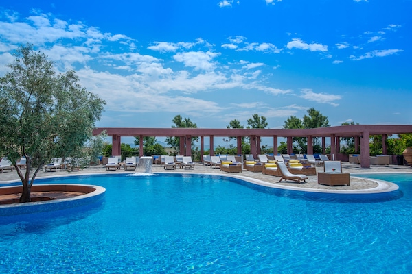Seasonal outdoor pool, open 8:00 AM to 8:00 PM, pool umbrellas
