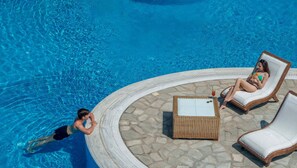 Seasonal outdoor pool, open 8:00 AM to 8:00 PM, pool umbrellas