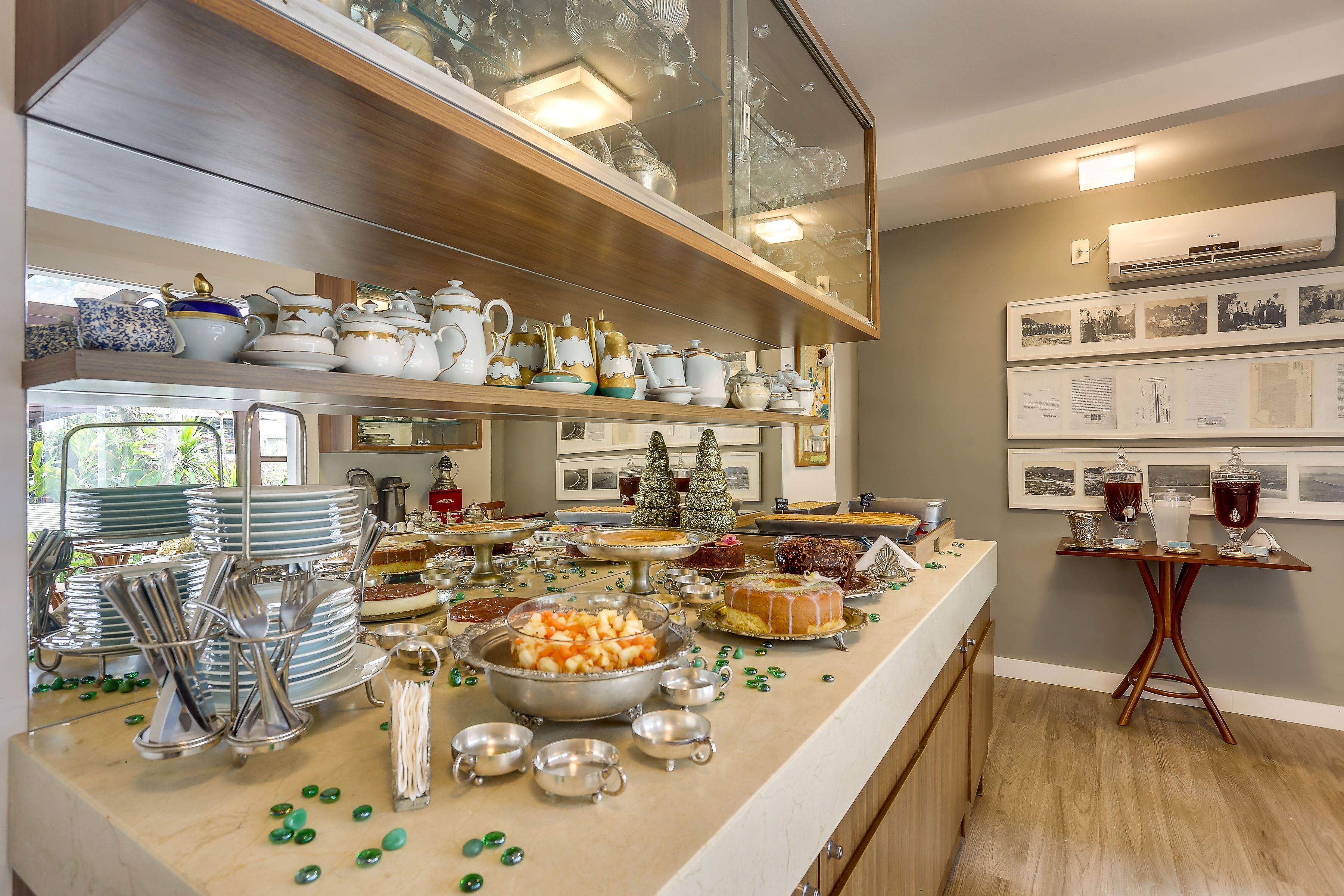 A buffet setup with various dishes and silverware.