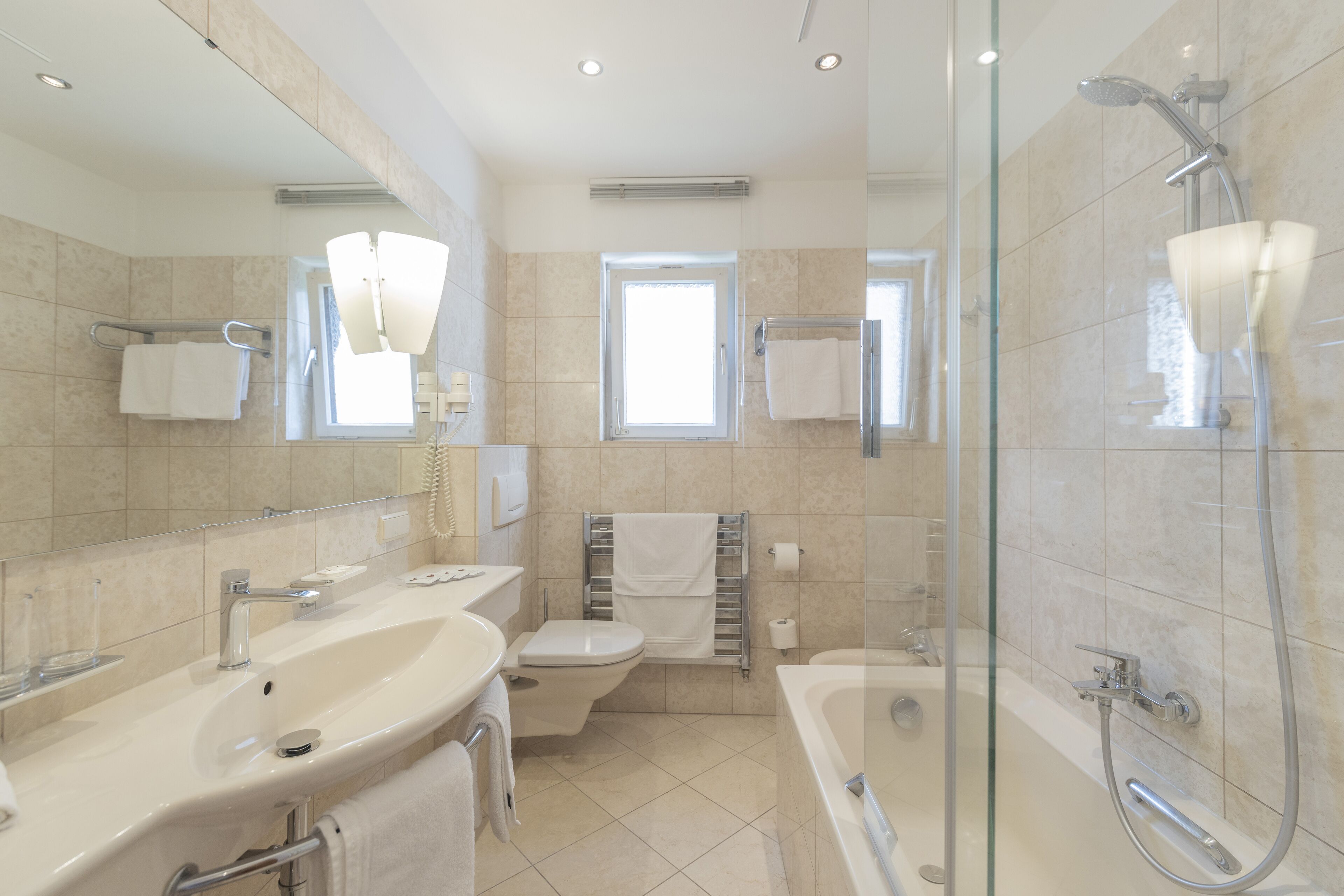 eco-friendly toiletries, hair dryer, slippers, towels