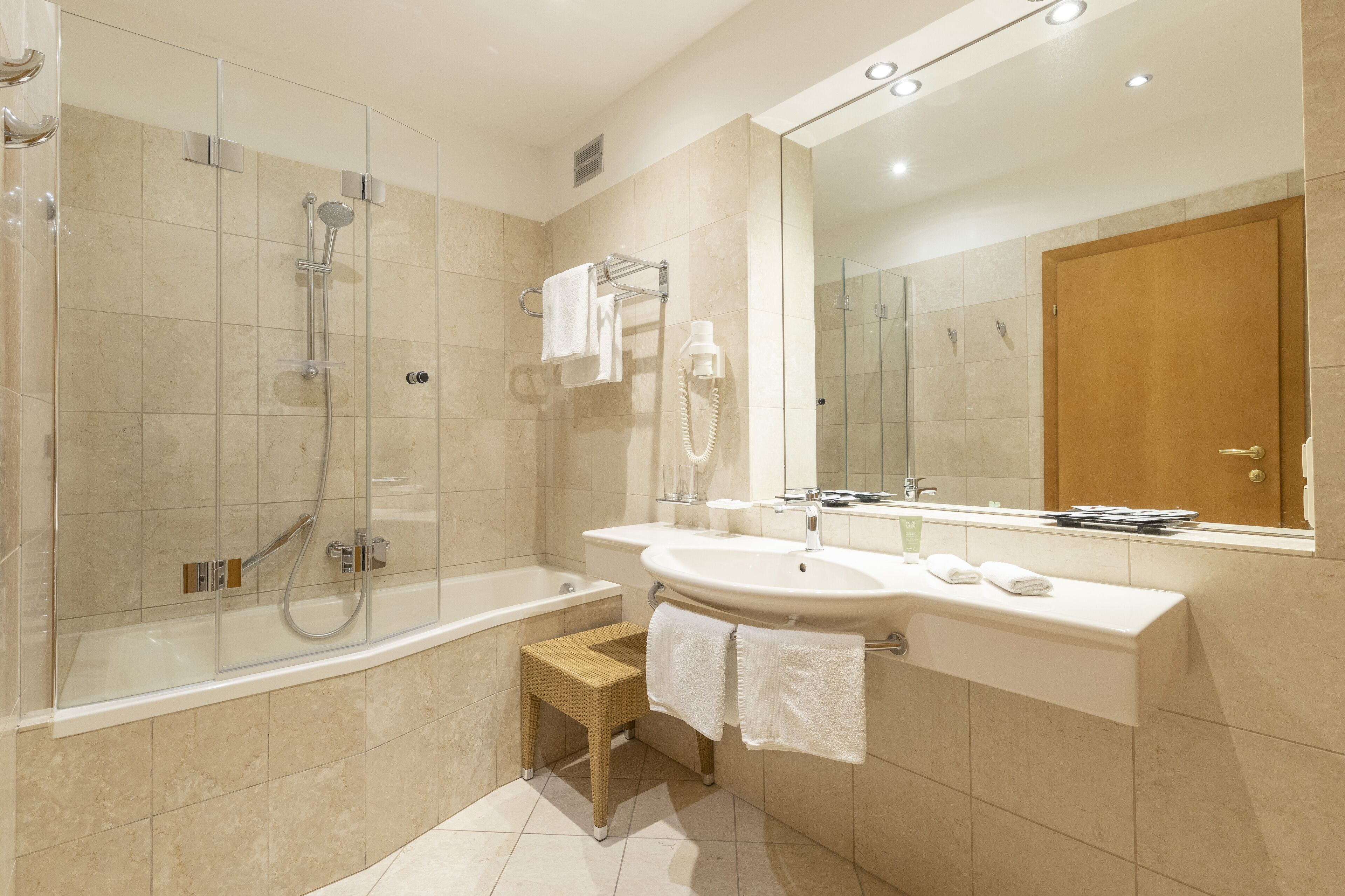 junior suite | bathroom | eco-friendly toiletries, hair dryer, slippers, towels