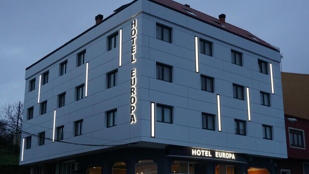 A multi-story hotel building with the name "HOTEL EUROPA" prominently displayed on the facade. - Europa (Arteixo)