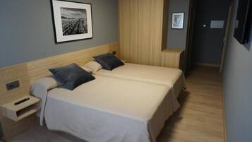 Frette Italian sheets, premium bedding, Tempur-Pedic beds, minibar