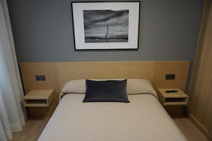 Frette Italian sheets, premium bedding, Tempur-Pedic beds, minibar