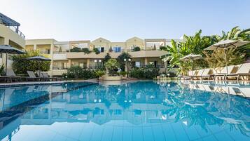 Outdoor pool, pool umbrellas, sun loungers
