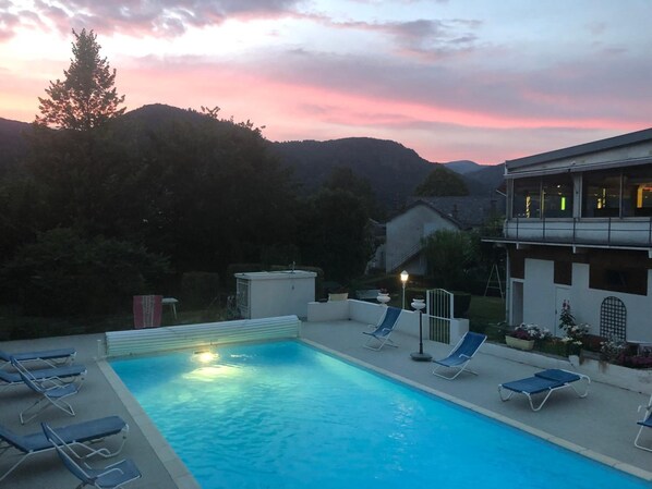 Outdoor pool, open 10:00 AM to 8:00 PM, pool loungers