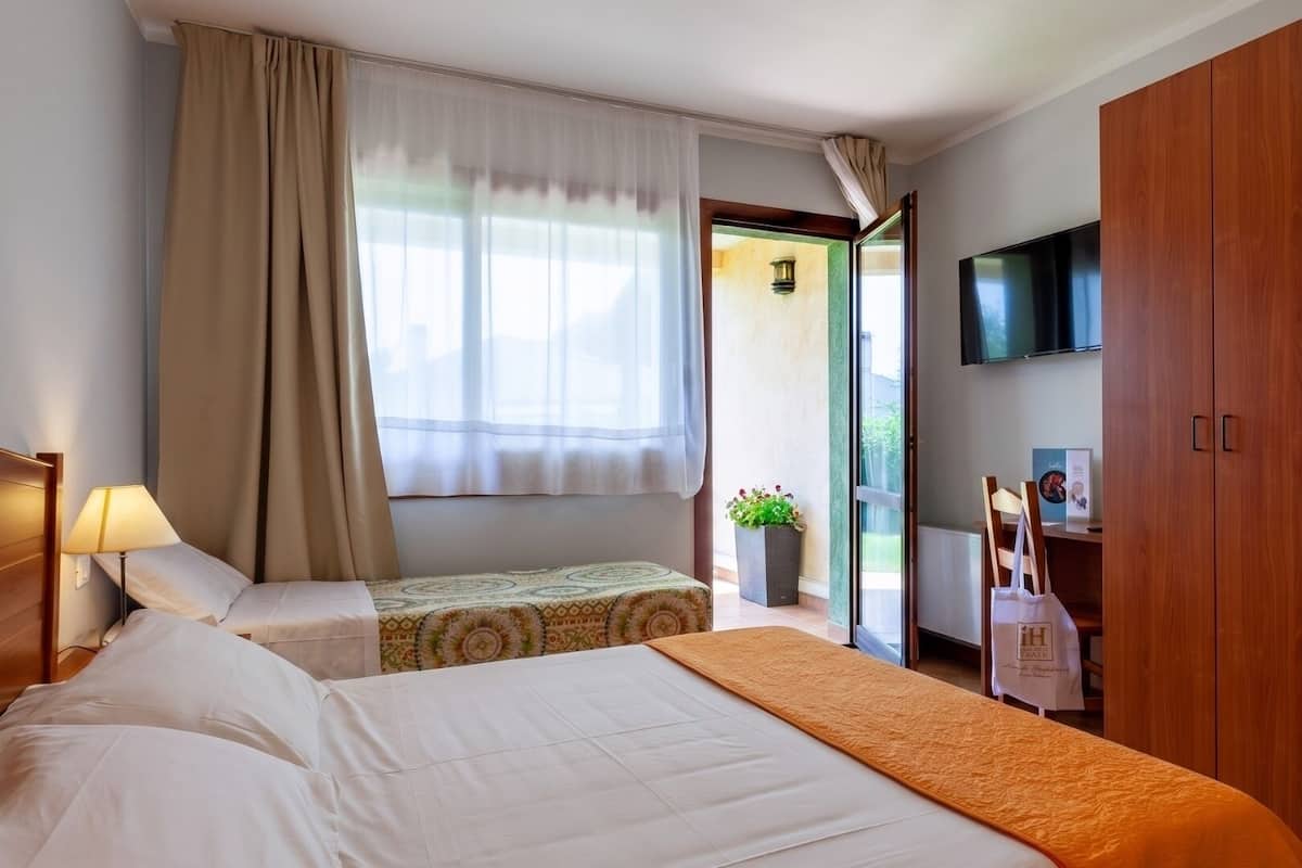 Standard Triple Room | Minibar, in-room safe, desk, soundproofing