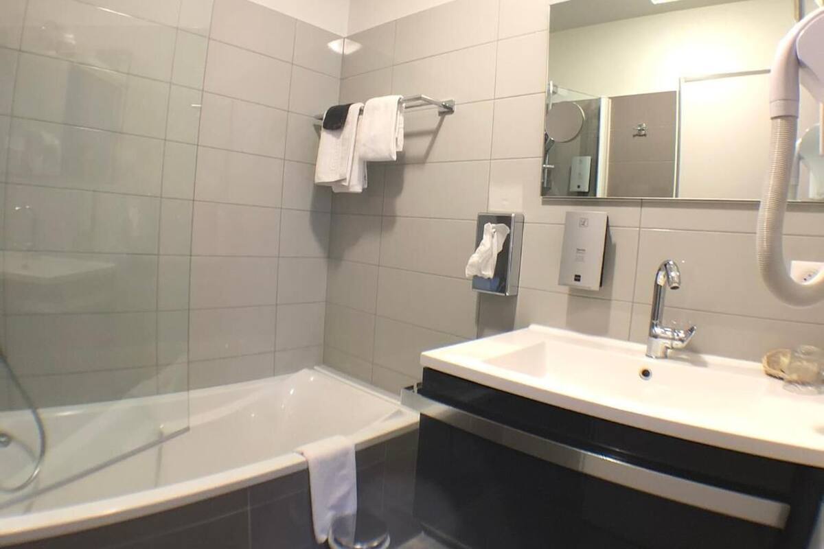 superior double room | bathroom | free toiletries, hair dryer, towels