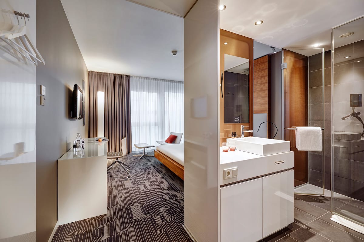 standard double room | bathroom | shower, rainfall showerhead, eco-friendly toiletries, hair dryer