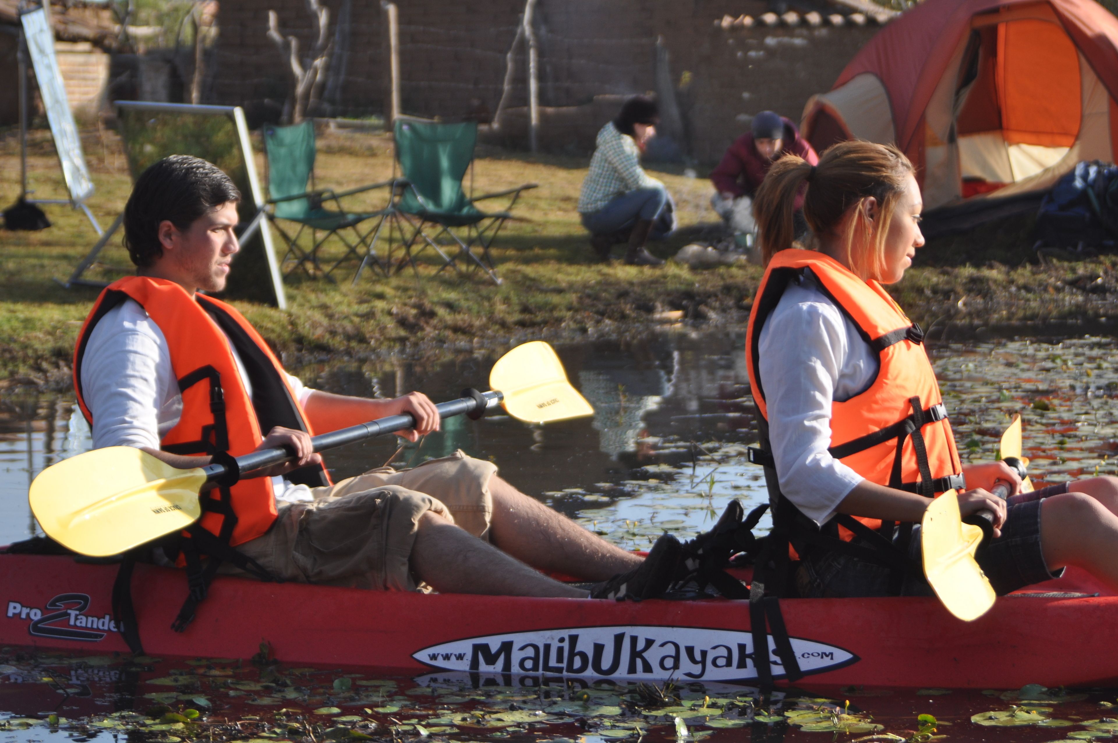 A kayak with a visible logo and text indicating it is a product of Malibu Kayak.