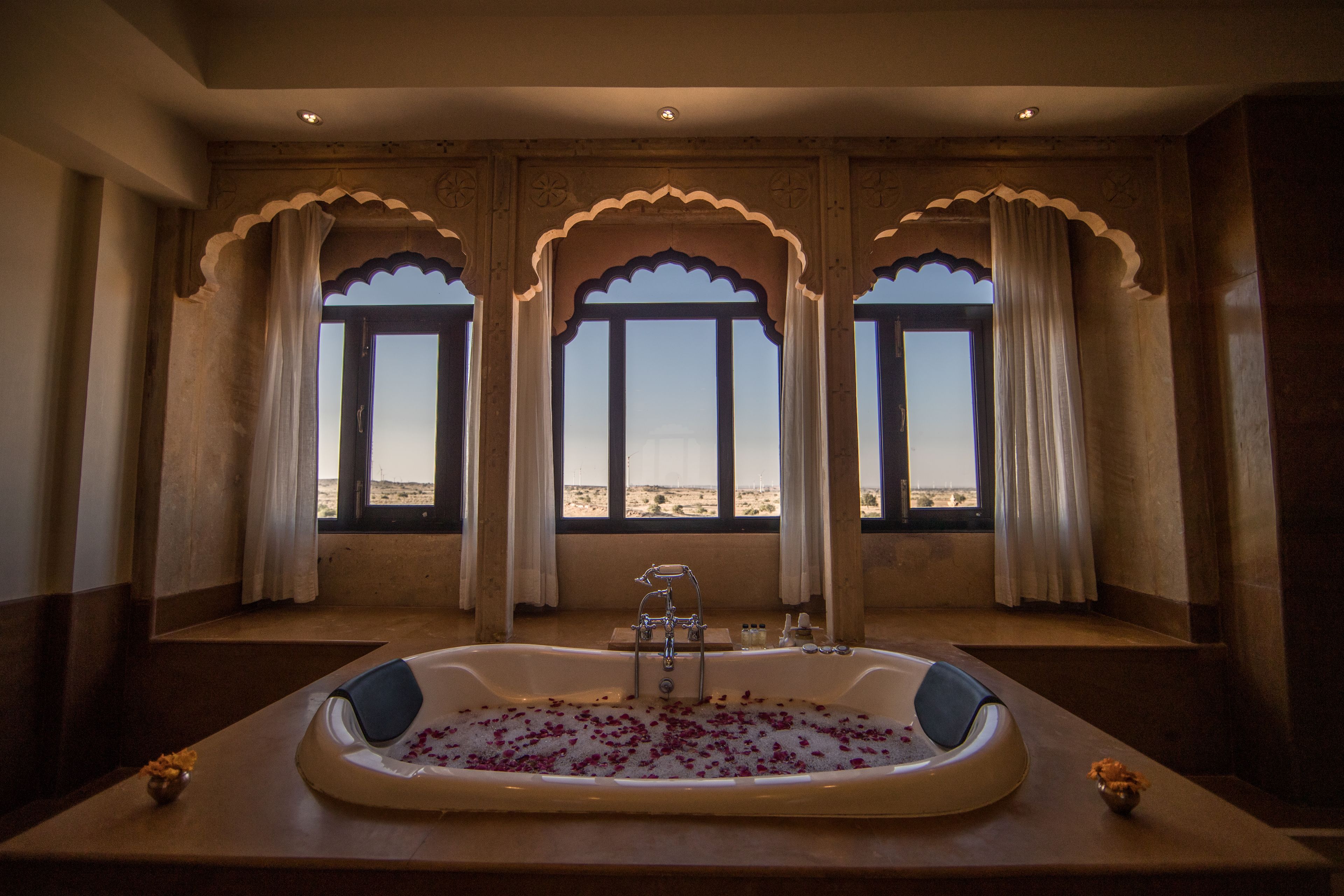 suryagarh suite | bathroom | rainfall showerhead, free toiletries, hair dryer, bathrobes