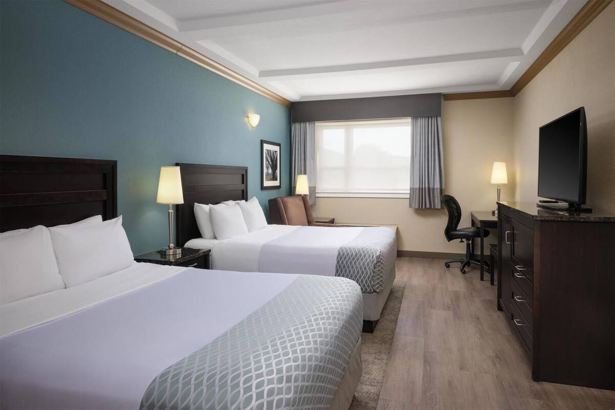 Pillowtop beds, desk, laptop workspace, blackout drapes