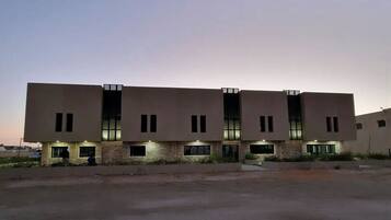 Stylish building with a symmetrical facade and rectangular windows.