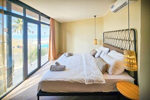 Premium Suite, Ocean View | In-room safe, desk, bed sheets