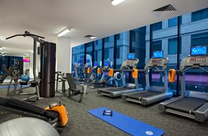 A gym with treadmills, weight machines, and exercise balls. - Citadines on Bourke Melbourne (Melbourne)