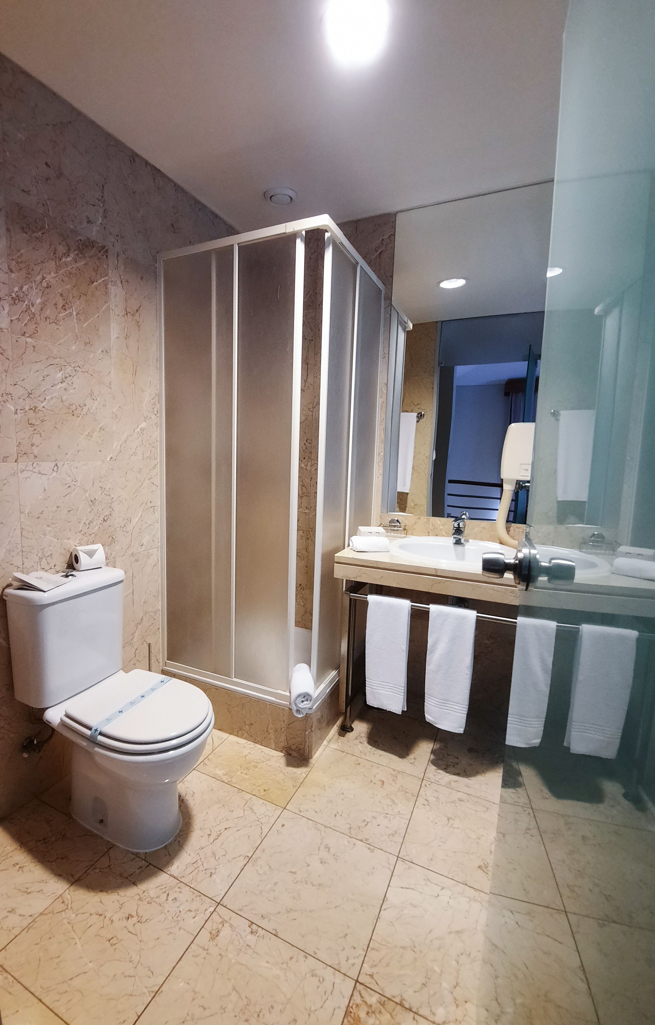 deluxe suite | bathroom | bathtub, eco-friendly toiletries, hair dryer, bidet