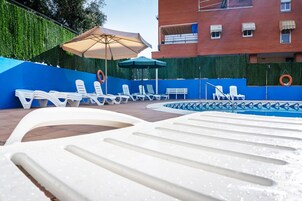 Outdoor pool, open 9 AM to 9:30 PM, sun loungers
