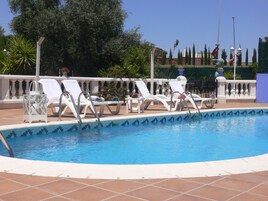 Outdoor pool, open 9 AM to 9:30 PM, sun loungers
