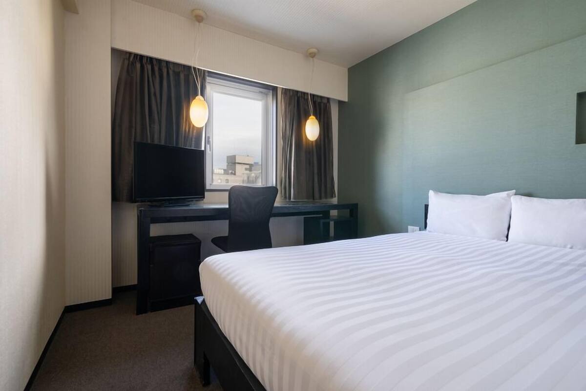 Desk, blackout curtains, iron/ironing board (on request), free WiFi