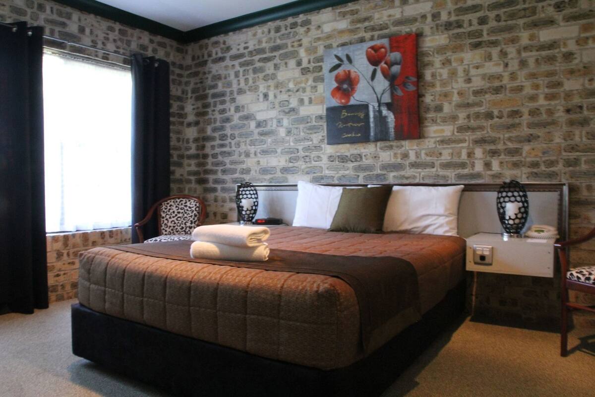 Desk, blackout drapes, iron/ironing board, WiFi