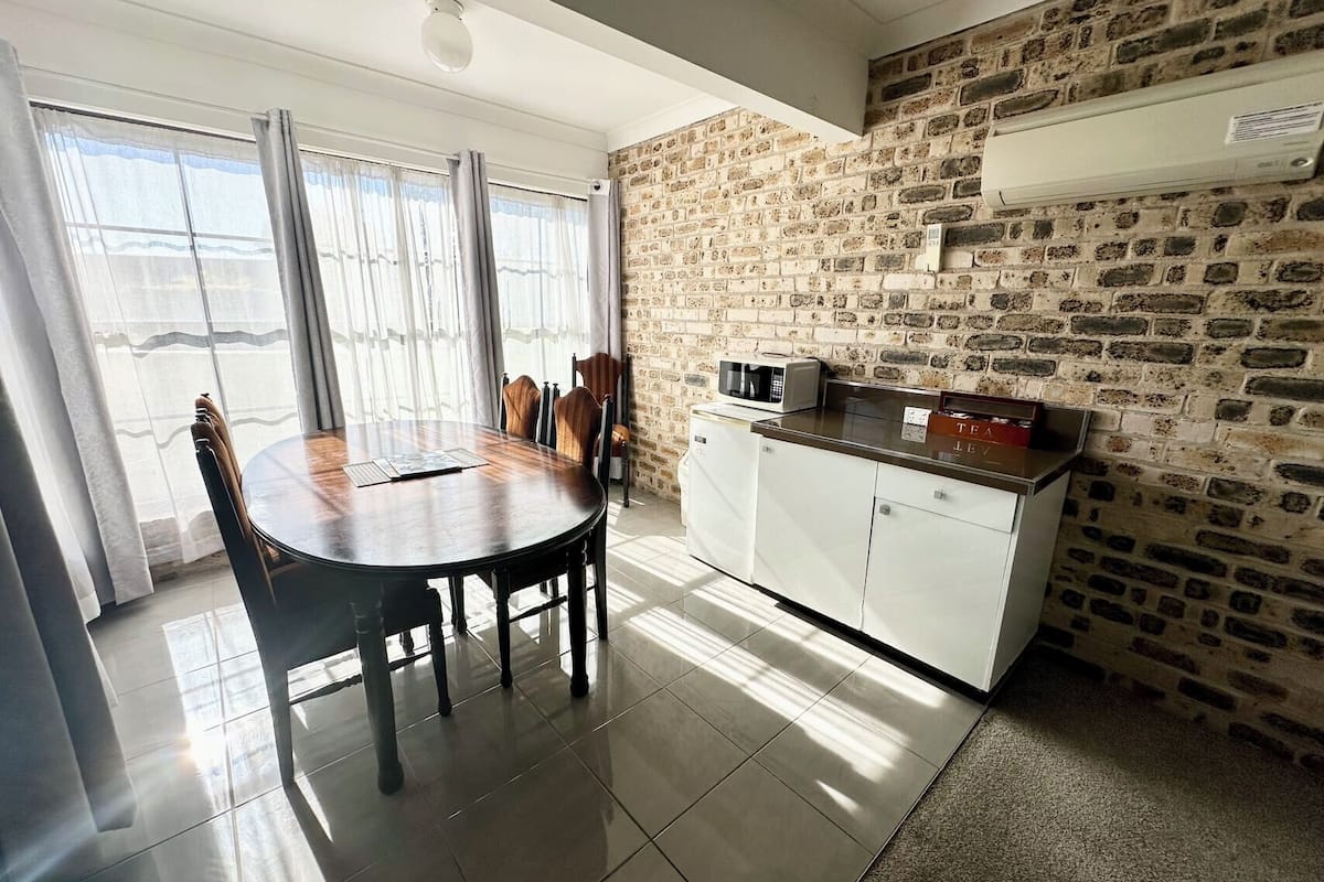 standard 2 bedroom family room | 1 bedroom, desk, blackout curtains, iron/ironing board